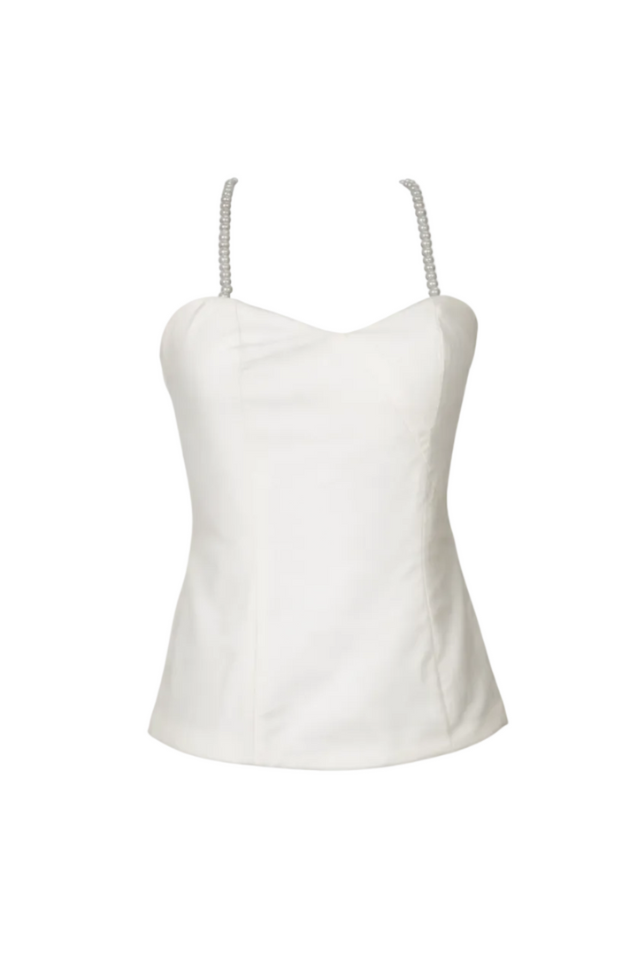 White strap top with pearl-like embellishments on thin straps against a white background