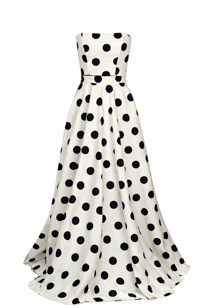 White dress with black polka dots on a white background