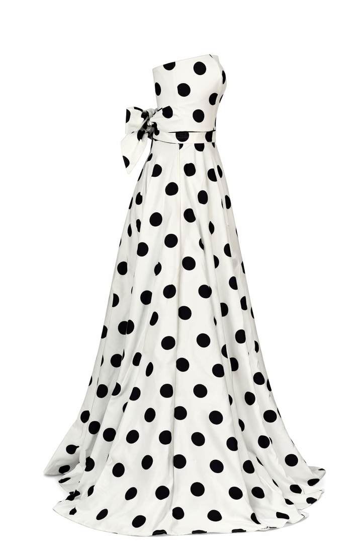 White evening gown with black polka dots on a white background